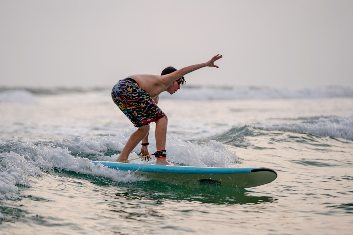A Boy Surfing